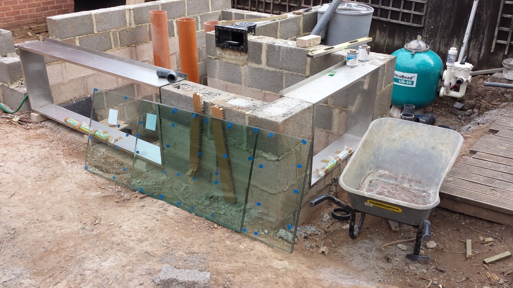 L-shape pond build with two pond window frames made of stainless steel